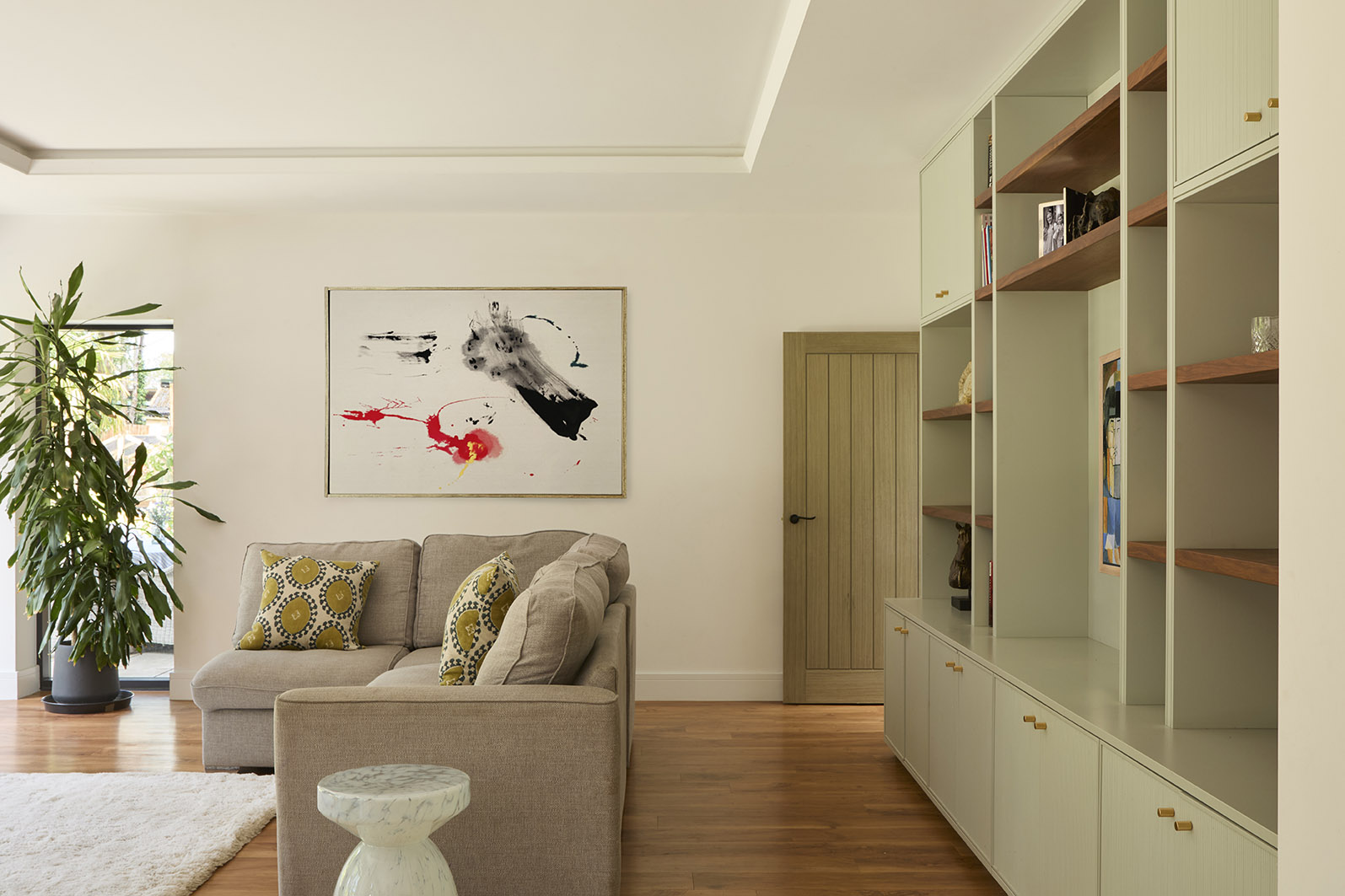 Modern home with open plan living room and large built-in wall unit.
