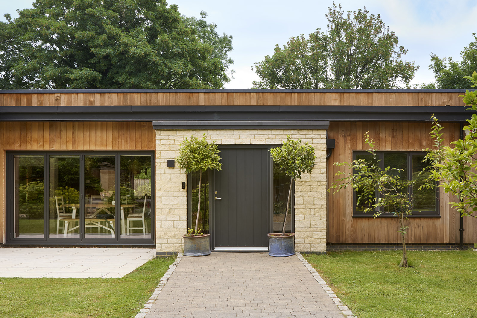 Costwold stone entrance new build house.