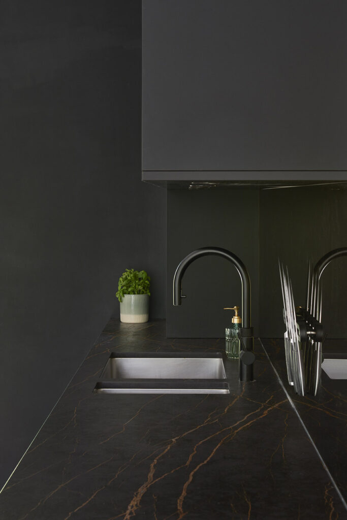 Brown contemporary kitchen with fitted units and appliances.