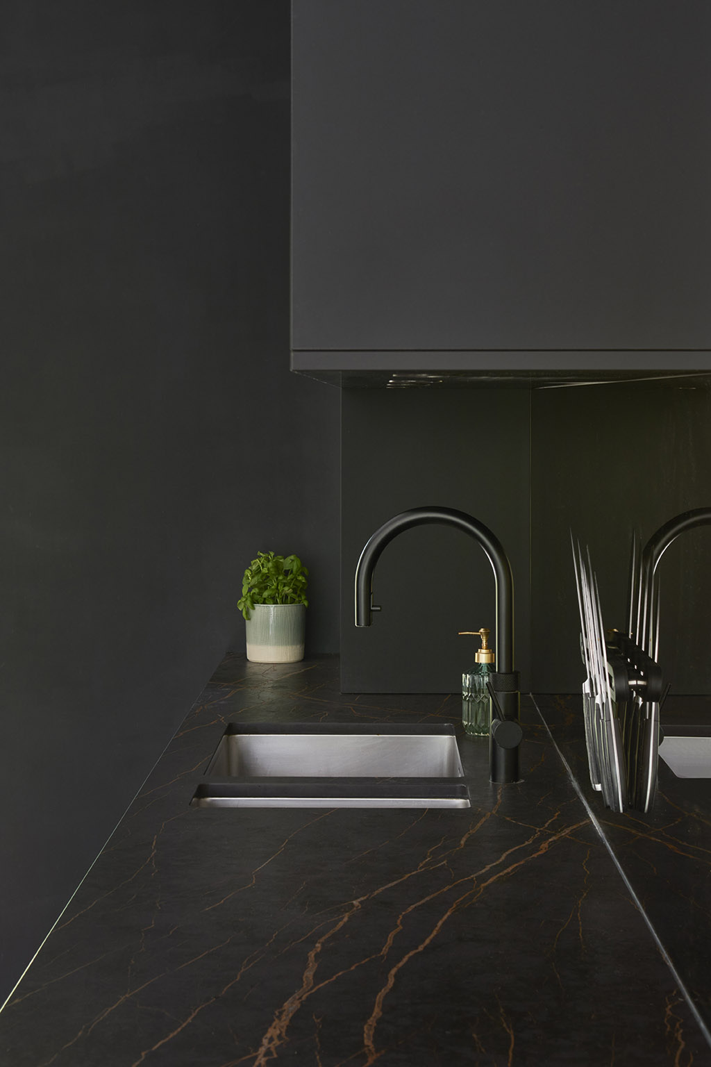 Brown contemporary kitchen with fitted units and appliances.