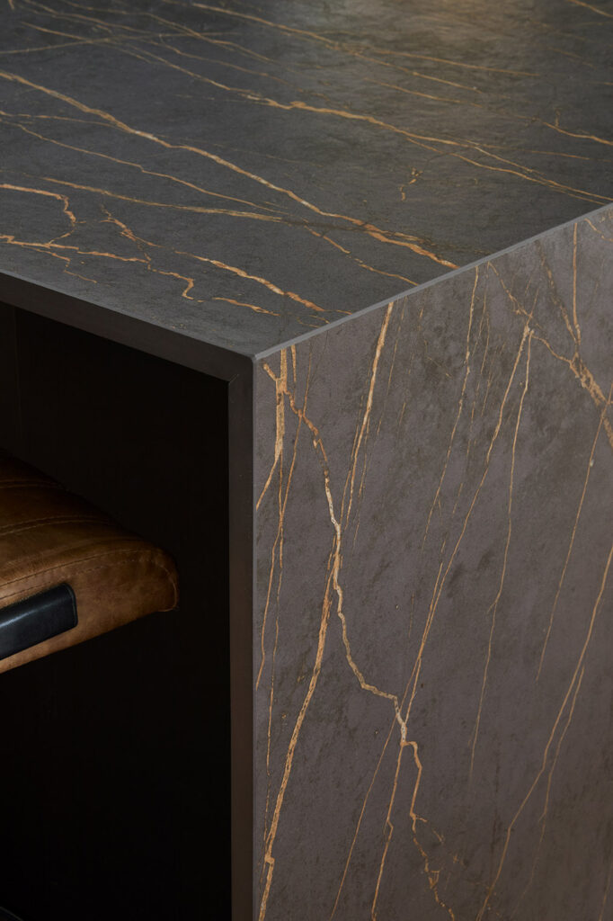 Large Dekton worktops finish the kitchen units beautifully.