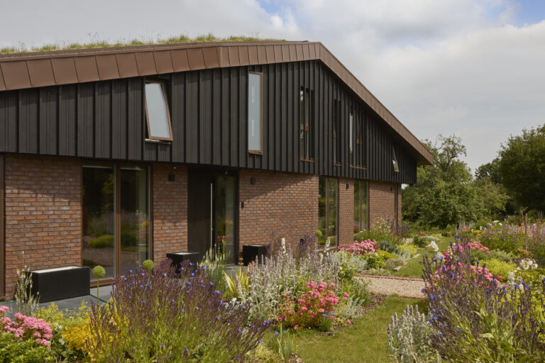 Contemporary new build home built by Beckwood with cladding, brick and copper exterior.